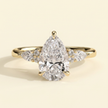 The Ilona - Pear Cut Lab Grown Diamond Three Claw Tulip Gallery Solitaire with Pear and Round Shoulder Stones Engagement Ring