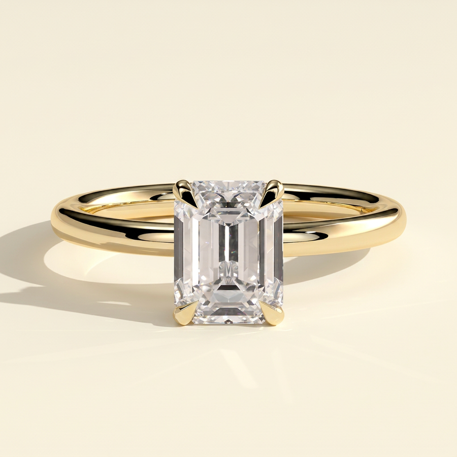 The Izara - Emerald Cut Lab Grown Diamond Four Claw Solitaire with Wrap Around Hidden Halo Engagement Ring - Yellow Gold