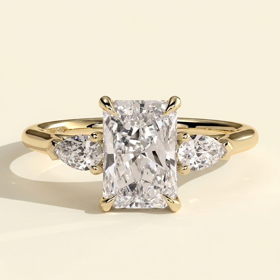 The Mirabel - Radiant Cut Lab Grown Diamond Three Stone Engagement Ring with Pear Side Stones - Yellow Gold