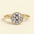 The Ysela - Round Cut Lab Grown Diamond Bezel Set Solitaire with Twisted Gallery Engagement Ring