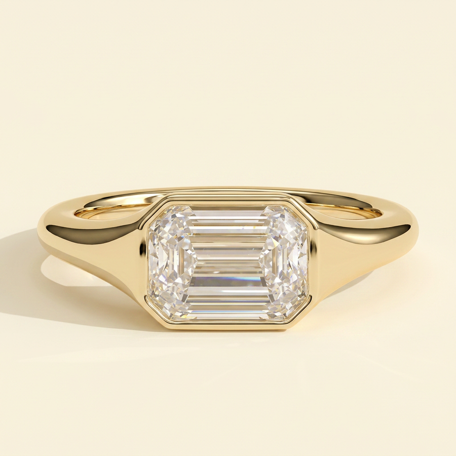 The Joia - Emerald Cut Lab Grown Diamond East West Bezel Set Solitaire with Signet Band Engagement Ring - Yellow Gold