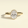 The Kelia - Oval Lab Grown Diamond Bezel Solitaire with Petal Gallery Setting