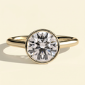 The Ceres - Round Cut Lab Grown Diamond Bezel Solitaire with Open Cathedral Setting Engagement Ring