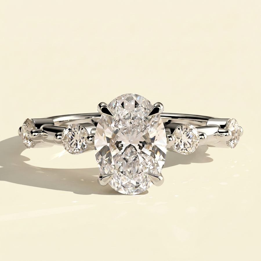 The Nuria - Oval Lab Grown Diamond Ring with Round Accents & Hidden Halo - White Gold