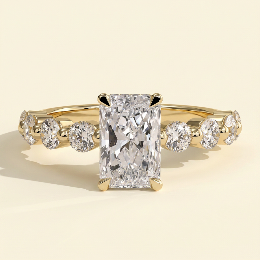 The Celia - Radiant Cut Lab Grown Diamond Four Claw Hidden Halo with Round Side Stones Engagement Ring - Yellow Gold
