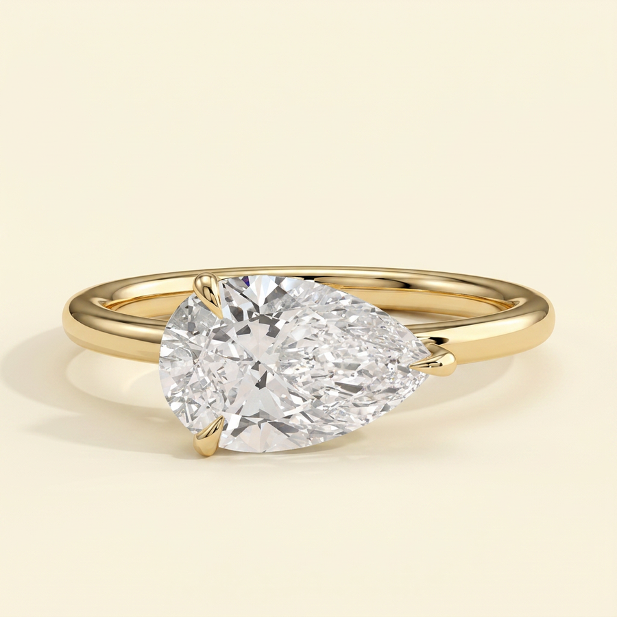The Riona - Pear Cut Lab Grown Diamond East West Solitaire with Raised Basket Gallery Engagement Ring - Yellow Gold