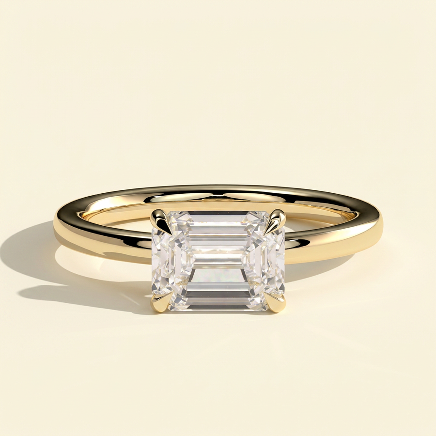 The Quila - Emerald Cut Lab Grown Diamond East West Solitaire Engagement Ring with Raised Basket - Yellow Gold