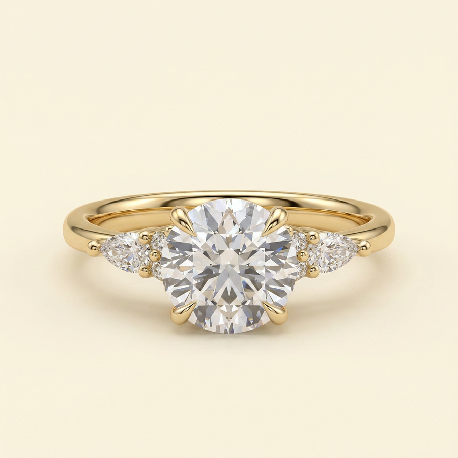 The Clea - Round Cut Lab Grown Diamond Three Stone with Pear Shoulder Stones and Tulip Gallery Engagement Ring - Yellow Gold