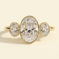 The Xiela - Oval Cut Lab Grown Diamond Three Stone Engagement Ring with Bezel Set Oval Side Stones