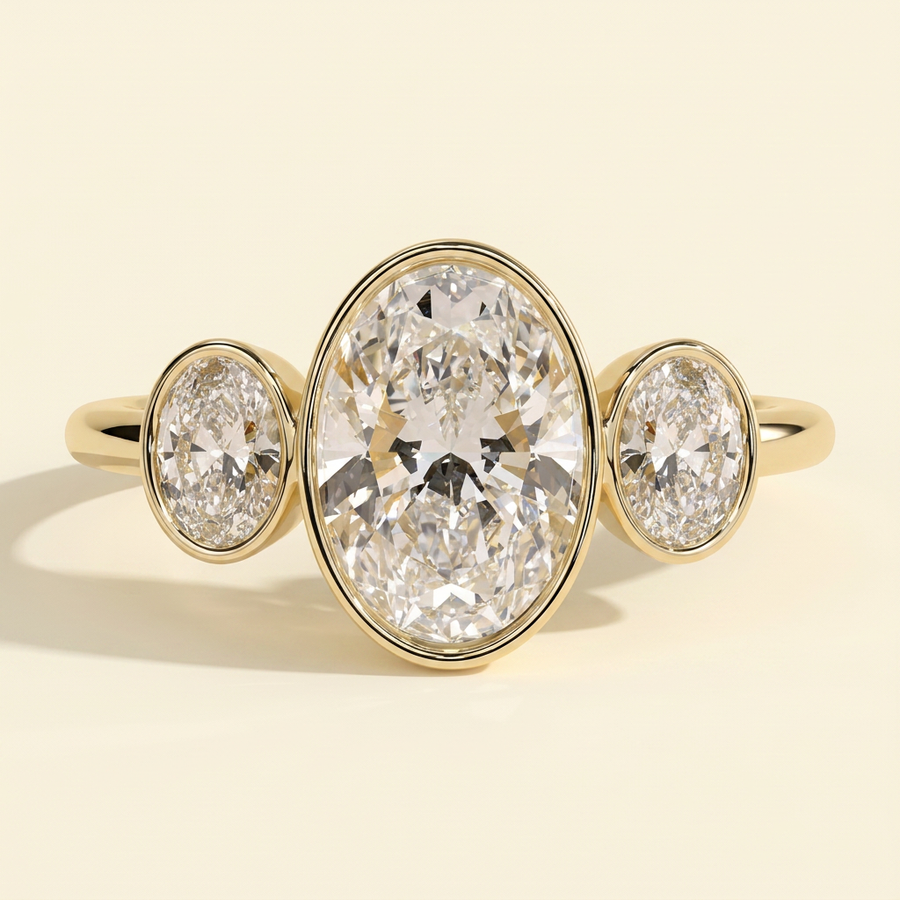The Xiela - Oval Cut Lab Grown Diamond Three Stone Engagement Ring with Bezel Set Oval Side Stones - Yellow Gold