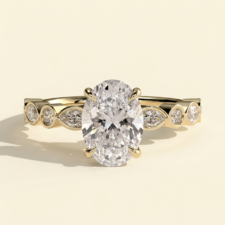 The Selina - Oval Cut Lab Grown Diamond Four Claw Solitaire with Bezel Set Round and Marquise Accent Stones Engagement Ring - Yellow Gold