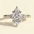 The Yara - Marquise Cut Lab Grown Diamond Six Claw Three Stone with Pear and Round Shoulder Stones Engagement Ring