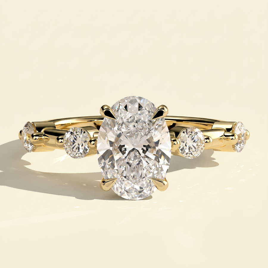 The Nuria - Oval Lab Grown Diamond Ring with Round Accents & Hidden Halo - Yellow Gold