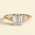 The Belisse - Emerald Cut Lab Grown Diamond Four Claw Solitaire with East West Pear and Round Shoulder Accents Engagement Ring
