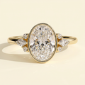 The Ziva - Oval Cut Lab Grown Diamond Bezel Set Solitaire with Marquise and Round Shoulder Stones Engagement Ring