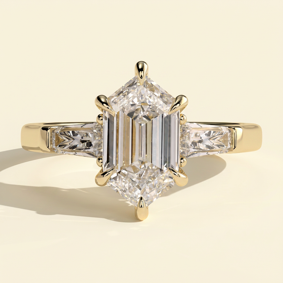 The Solara - Elongated Hexagon Cut Lab Grown Diamond Three Stone with Tapered Baguette Side Stones and Cathedral Setting Engagement Ring - Yellow Gold