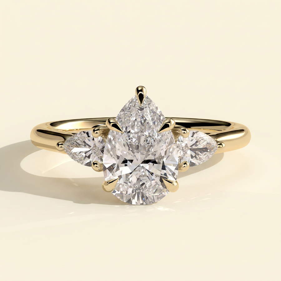 The Viorela - Pear Cut Lab Grown Diamond Three Stone Engagement Ring with Pear Side Stones and Floating Cathedral Setting - Yellow Gold