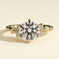 The Zephyra - Round Cut Lab Grown Diamond Basket Set Solitaire with Clustered Round Shoulder Stones Engagement Ring