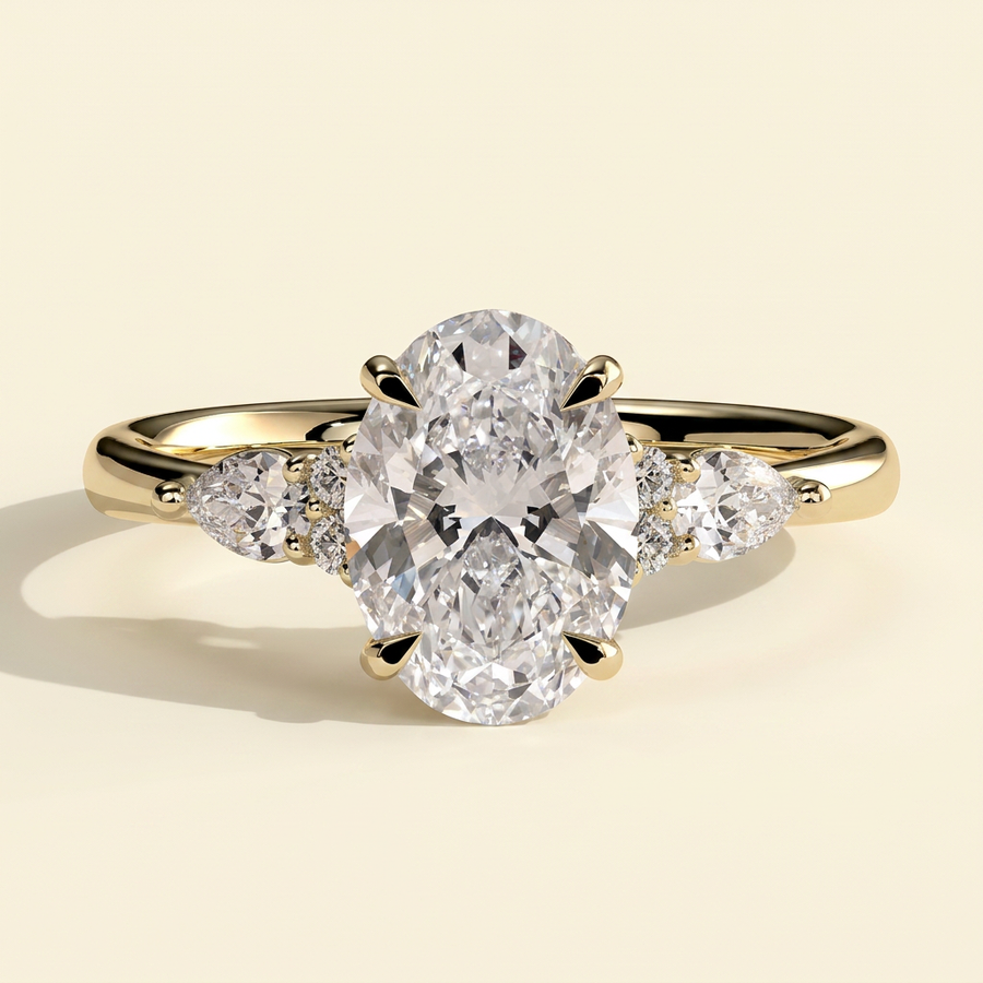 The Rialta - Oval Cut Lab Grown Diamond Three Stone Engagement Ring with Pear and Round Side Stones - Yellow Gold
