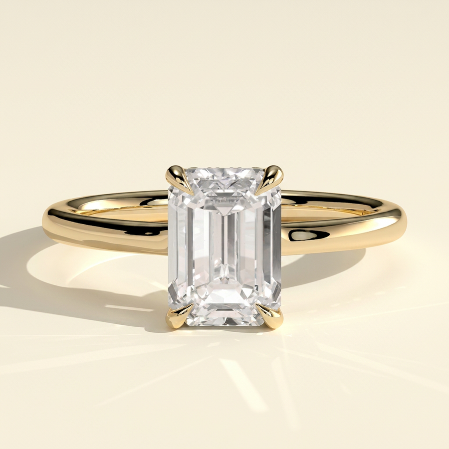 The Solera - Emerald Cut Lab Grown Diamond Low Set Solitaire with Hidden Halo and Open Bridge Engagement Ring - Yellow Gold