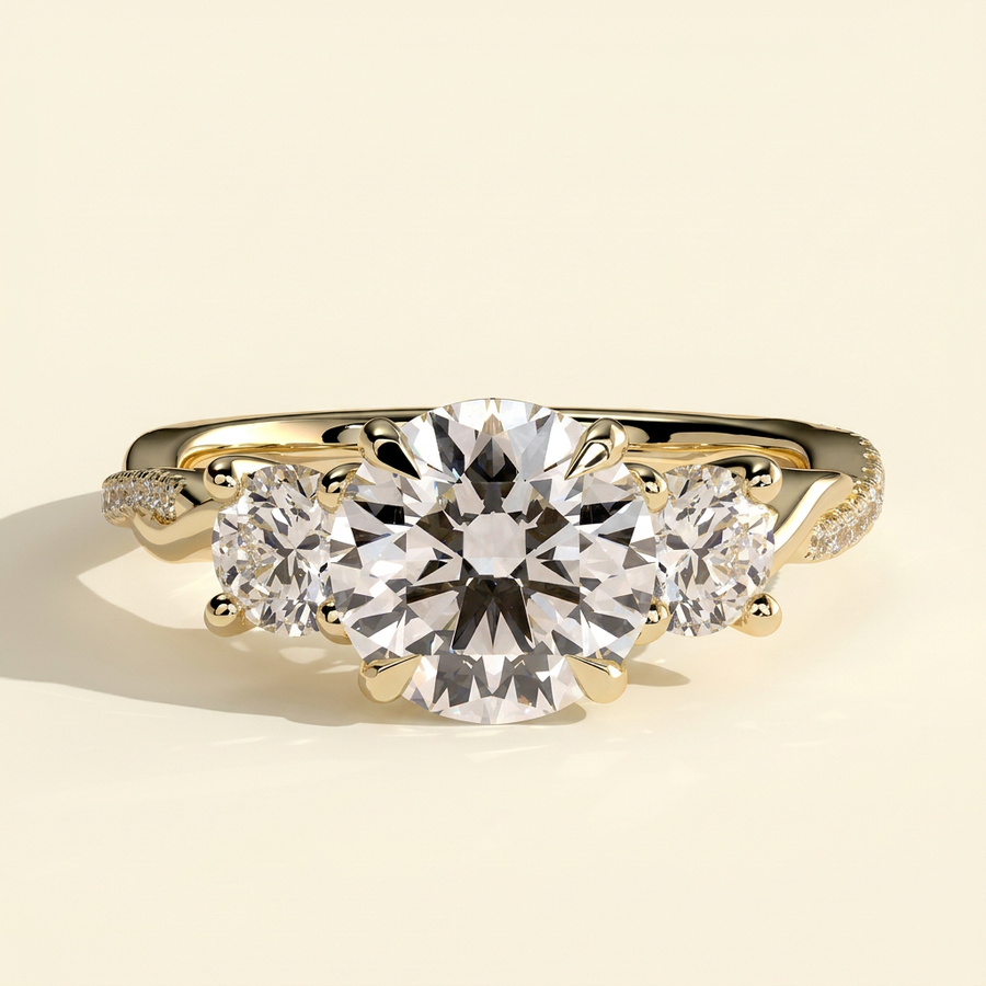 The Golda - Round Cut Lab Grown Diamond Three Stone Engagement Ring with Twisted Pave Band - Yellow Gold