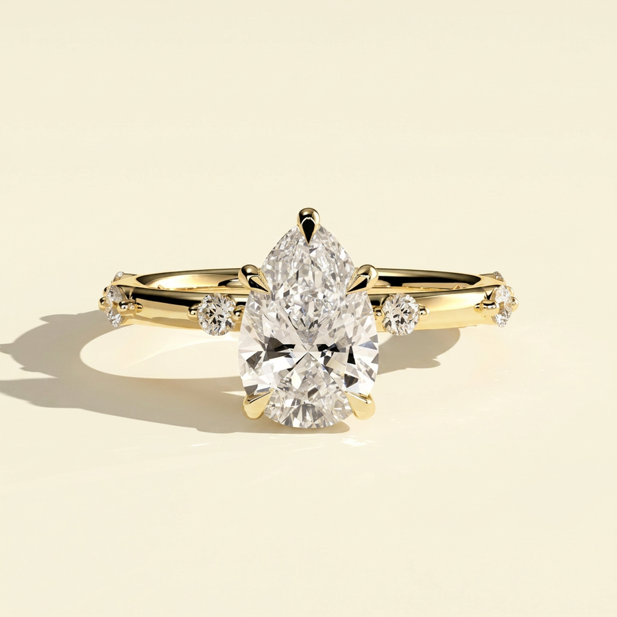 The Nixie - Pear Cut Lab Grown Diamond Ring with Hidden Halo and Accents - Yellow Gold