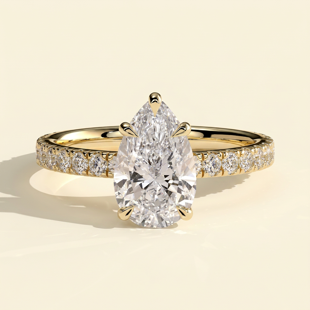 The Estella - Pear Cut Lab Grown Diamond Solitaire with Pave Band Engagement Ring