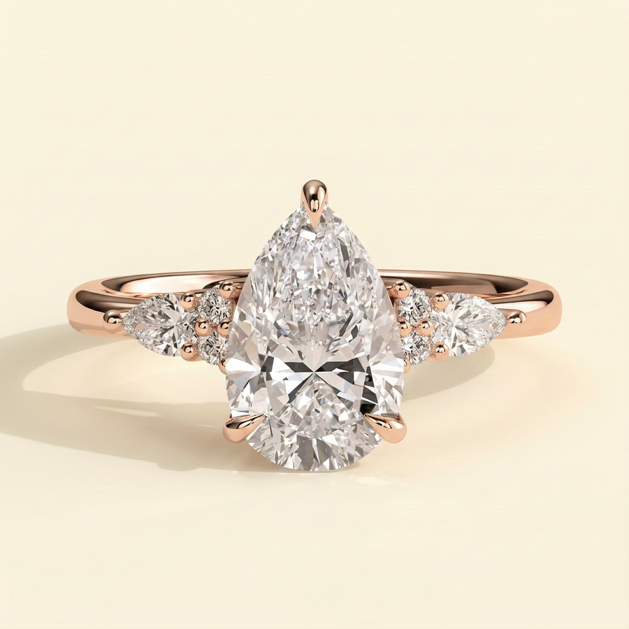 The Ilona - Pear Cut Lab Grown Diamond Three Claw Tulip Gallery Solitaire with Pear and Round Shoulder Stones Engagement Ring - Rose Gold