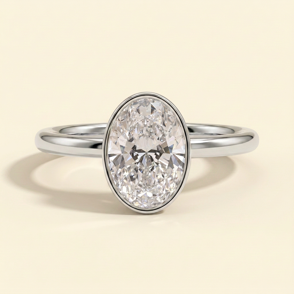 The Uriela - Oval Cut Lab Grown Diamond Bezel Set Solitaire Engagement Ring