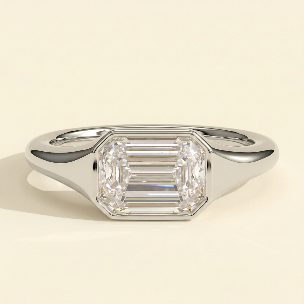 The Joia - Emerald Cut Lab Grown Diamond East West Bezel Set Solitaire with Signet Band Engagement Ring