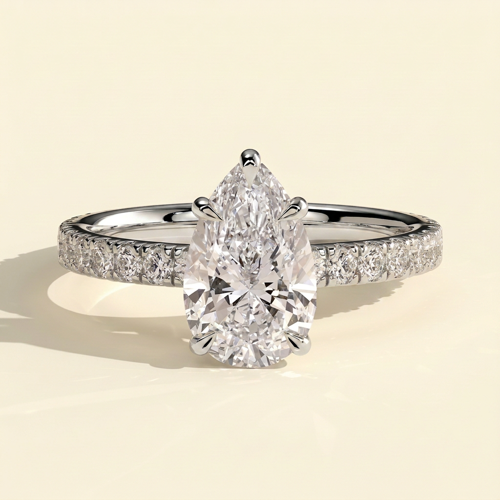 The Estella - Pear Cut Lab Grown Diamond Solitaire with Pave Band Engagement Ring