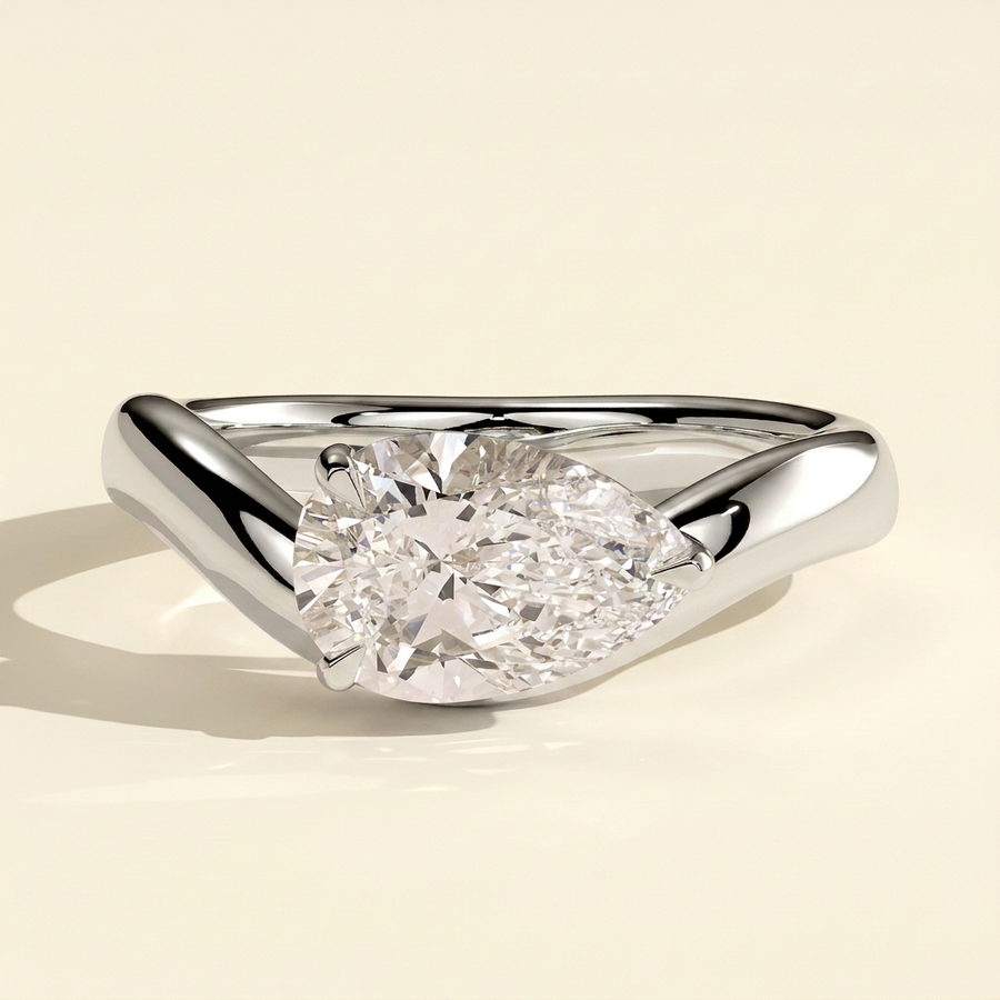 The Celina - Pear Cut Lab Grown Diamond East West Solitaire with Wave Band Engagement Ring - White Gold