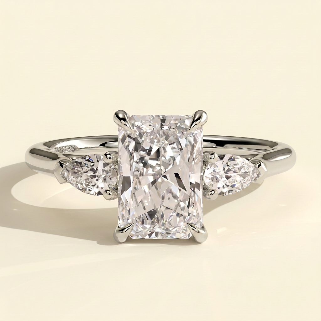 The Mirabel - Radiant Cut Lab Grown Diamond Three Stone Engagement Ring with Pear Side Stones