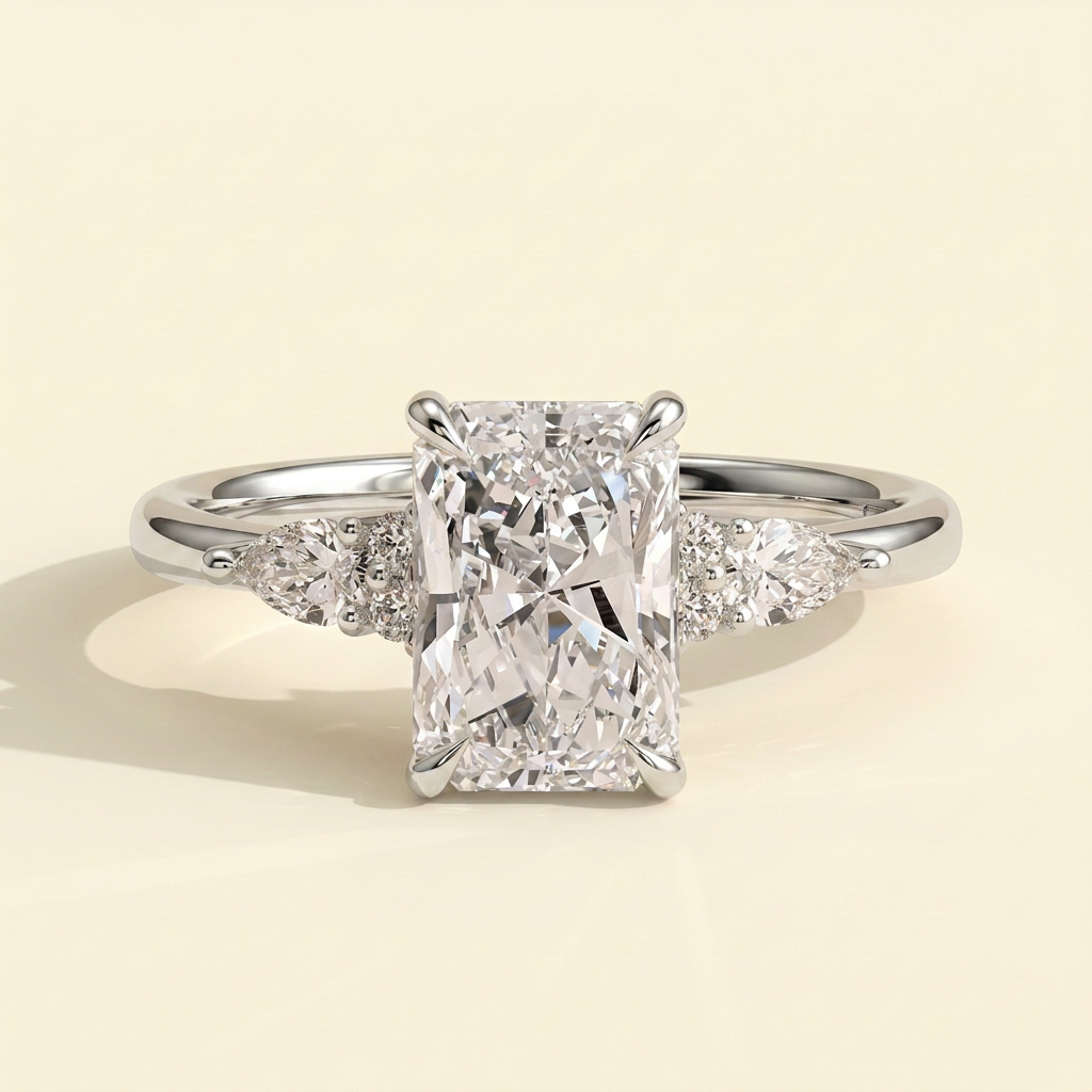 The Raina - Radiant Cut Lab Grown Diamond Three Stone Tulip Gallery Ring with Pear Side Stones