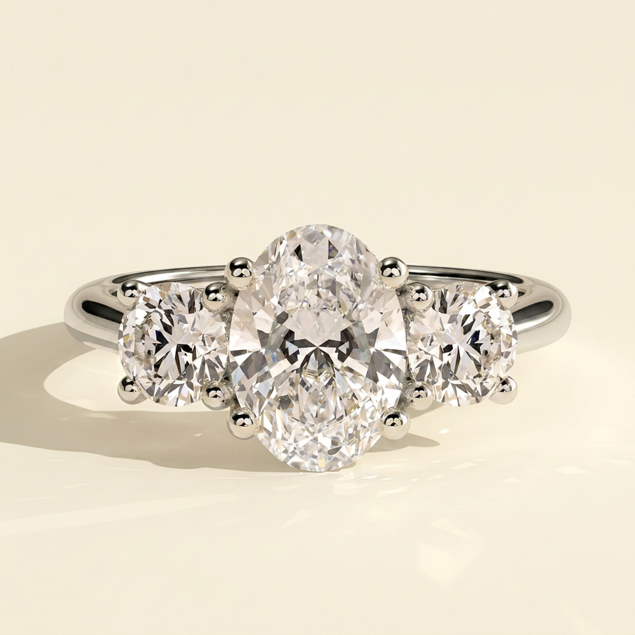 The Gemma - Oval Cut Lab Grown Diamond Three Stone Engagement Ring with Round Side Stones - White Gold