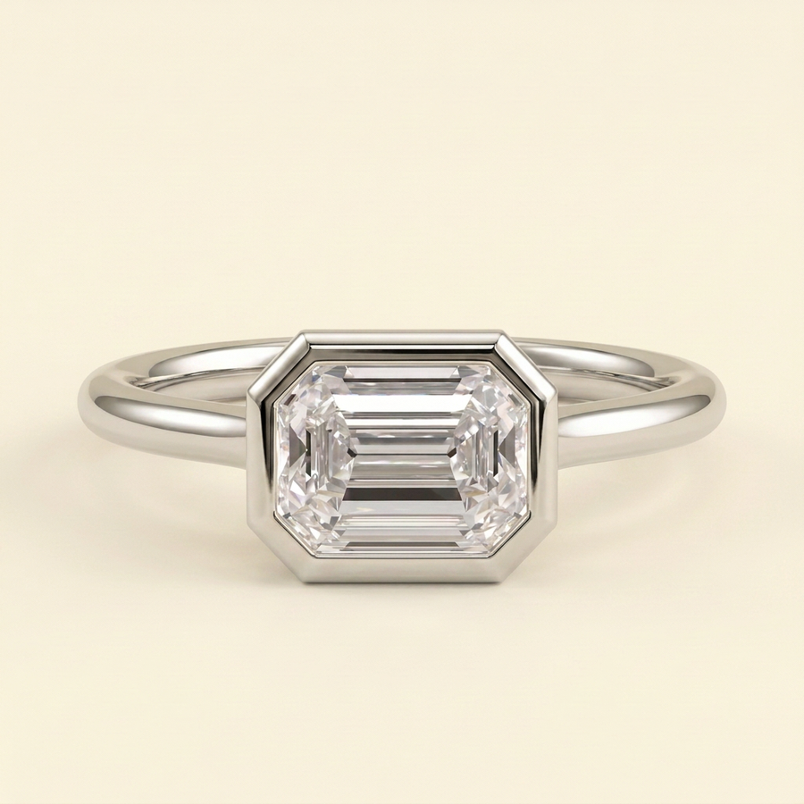 The Zaia - Emerald Cut Lab Grown Diamond East West Bezel Set Solitaire with Open Cathedral Setting Engagement Ring - White Gold