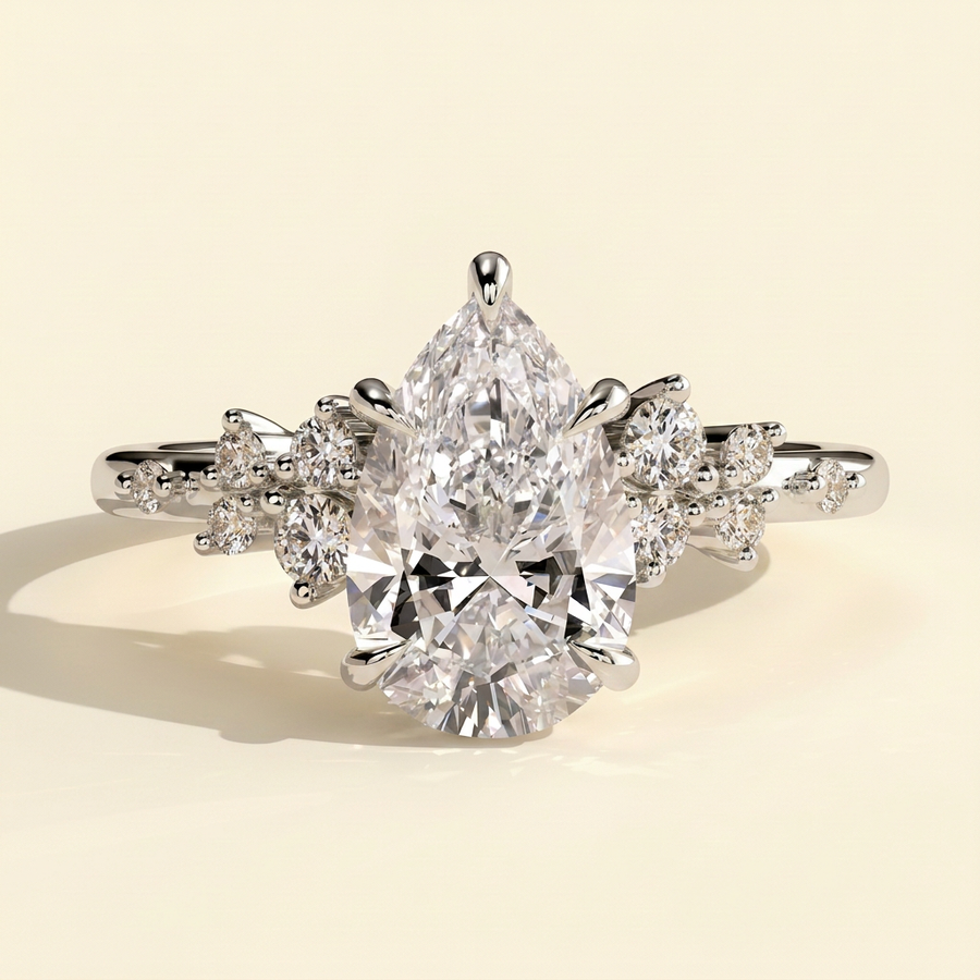 The Zivelle - Pear Cut Lab Grown Diamond Basket Set Solitaire with Clustered Round Shoulder Stones Engagement Ring - White Gold