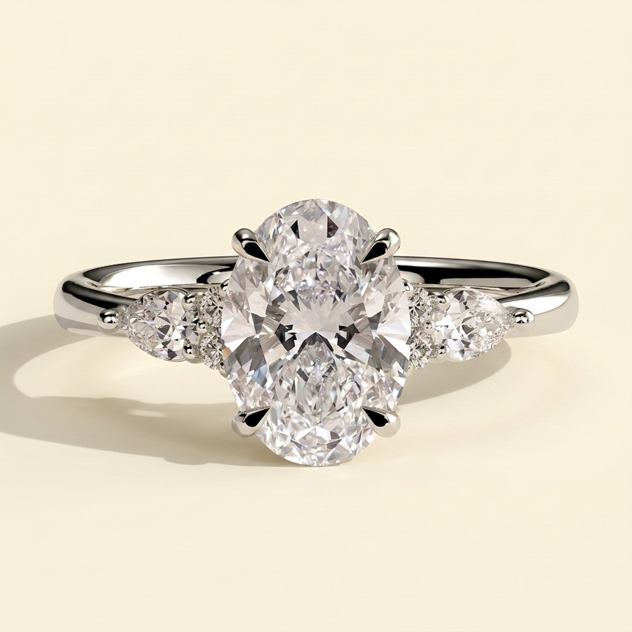 The Rialta - Oval Cut Lab Grown Diamond Three Stone Engagement Ring with Pear and Round Side Stones - White Gold