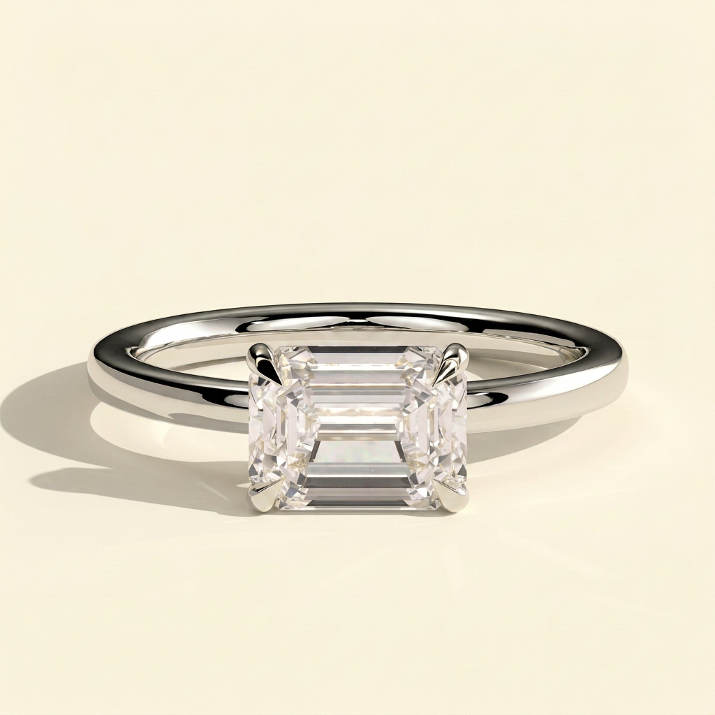 The Quila - Emerald Cut Lab Grown Diamond East West Solitaire Engagement Ring with Raised Basket