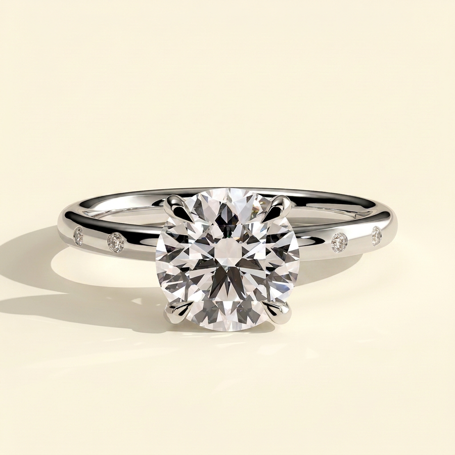 The Diamara - Round Cut Lab Grown Diamond Solitaire with Inset Round Side Stones in a Sleek Band Engagement Ring - White Gold
