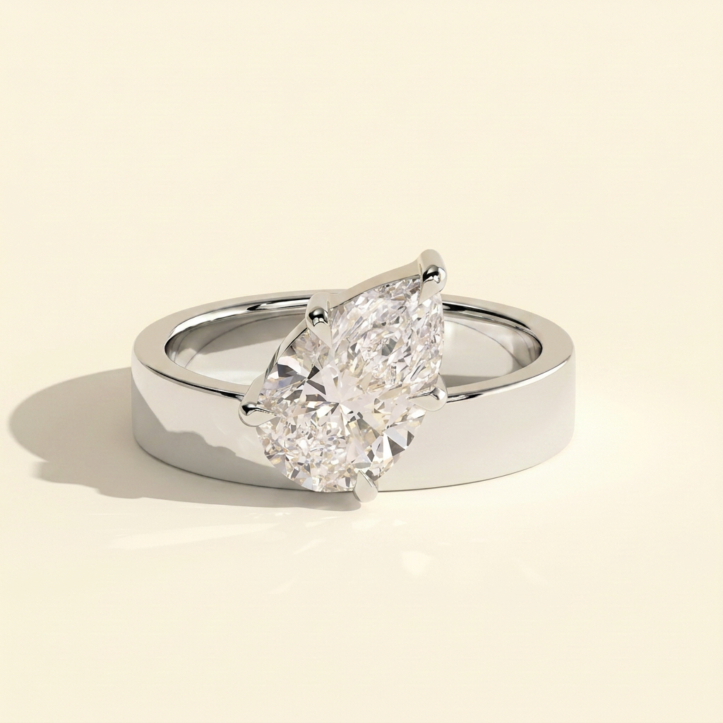 The Carina - Pear Cut Lab Grown Diamond Offset Angled Solitaire with Flat Cigar Band Engagement Ring
