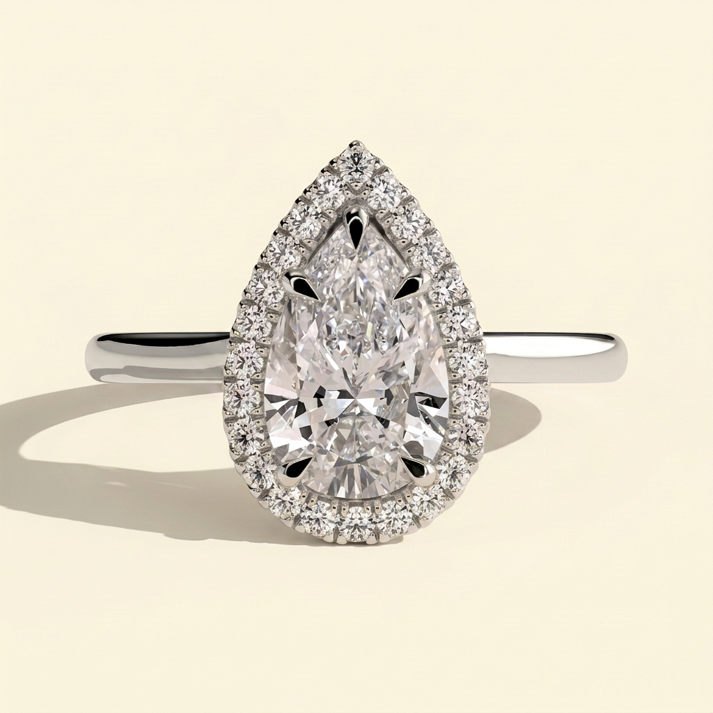 The Eleria - Pear Cut Lab Grown Diamond Five Claw Halo Engagement Ring with Cathedral High Setting